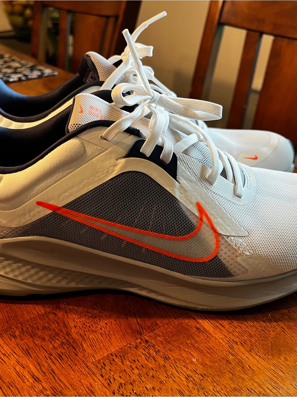 Nike White Sneakers with Navy Collar and Orange Accents